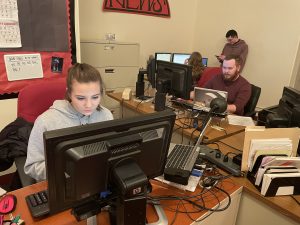 Collegian Sports Editor Emily Rupczewski and Managing Editor Caleb West work on pages at their design stations in the Keystone Student Media Award-winning